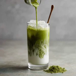 Pouring matcha into lavender latte